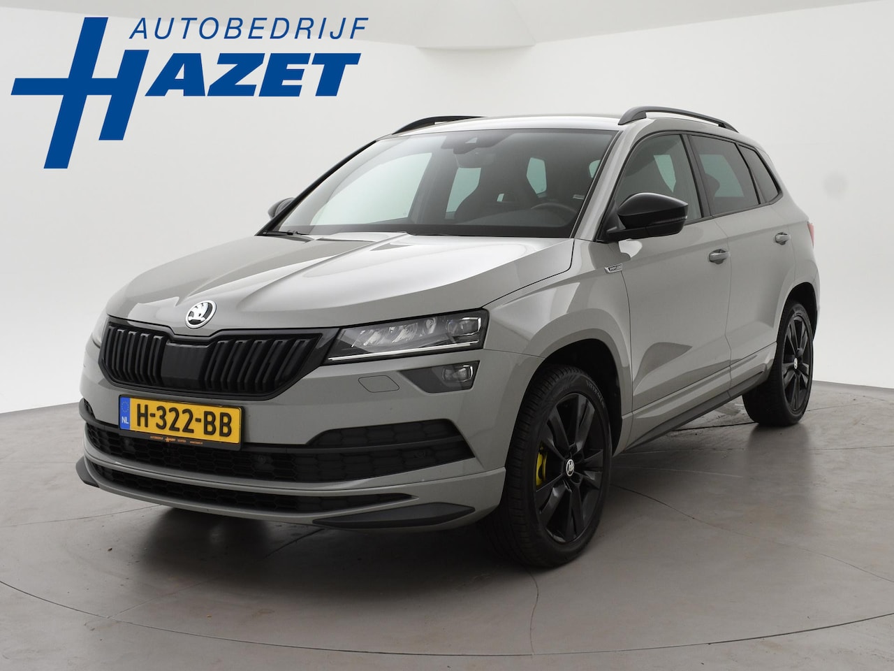 Skoda Karoq - 1.5 TSI ACT SPORTLINE + WEGKL. TREKHAAK | VOL LEDER | ADAPTIVE CRUISE | CANTON | CAMERA - AutoWereld.nl