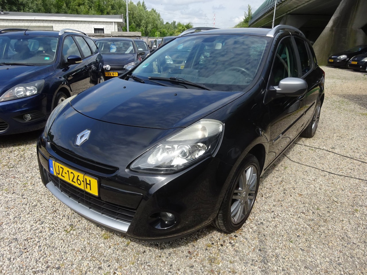 Renault Clio Estate - 1.2 TCE 20th Anniversary Airco Dak Rails Navi Radio/Cd Parkeer Sensoren - AutoWereld.nl