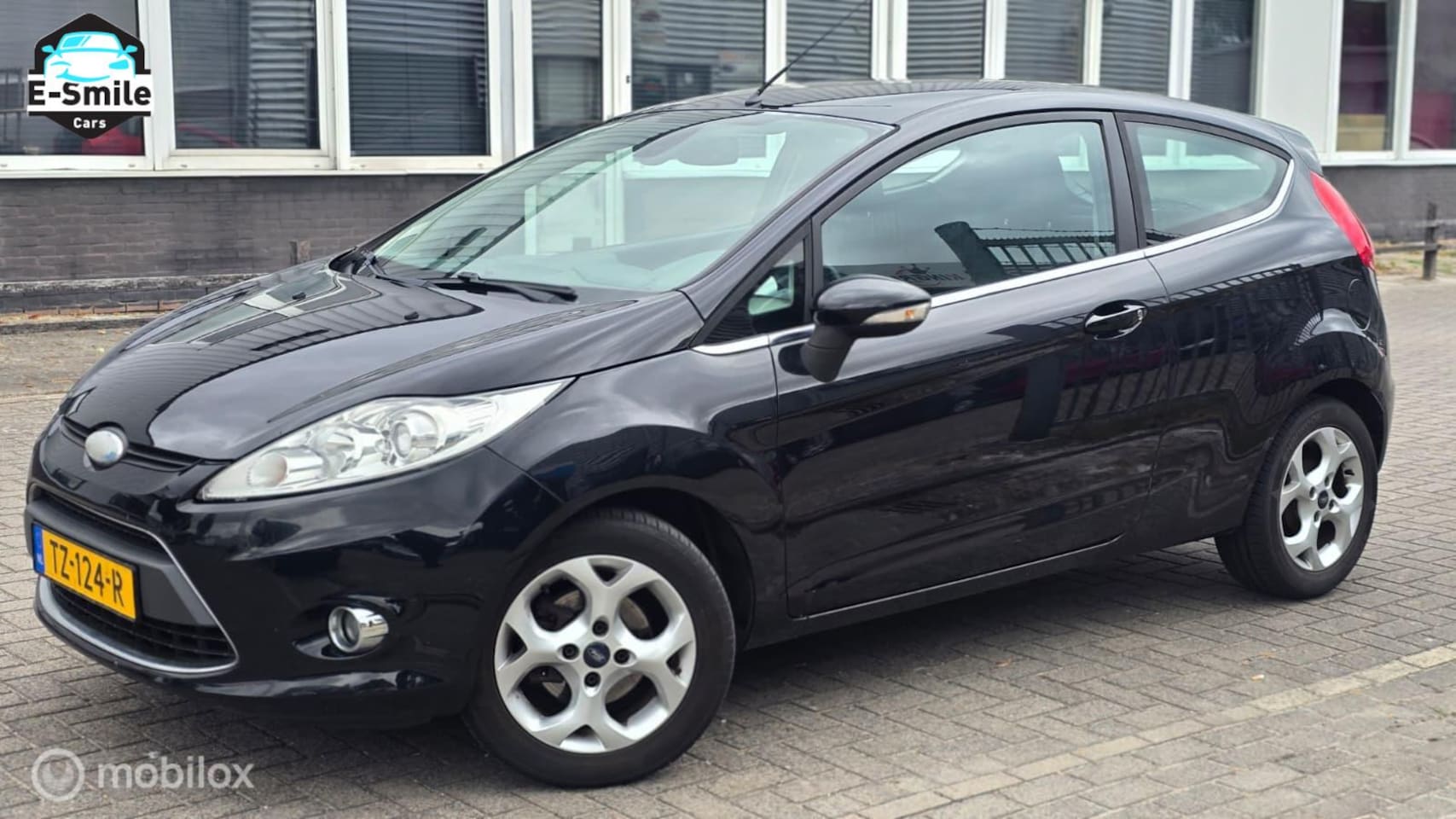 Ford Fiesta - 1.25 Ghia/Airco/StoelVerwarming/MultiStuur - AutoWereld.nl