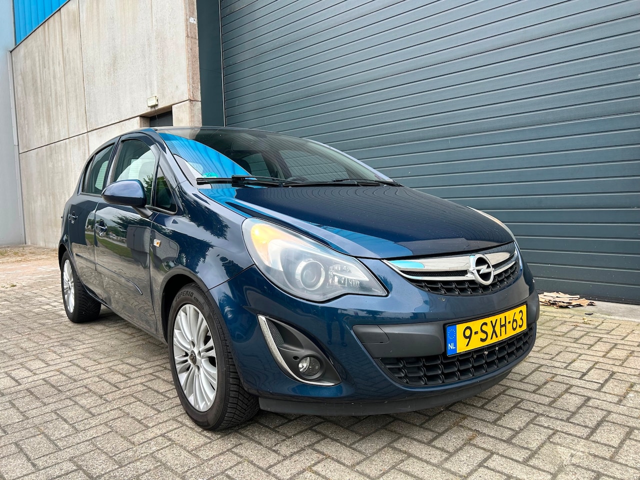 Opel Corsa - 1.2i 16V Cosmo AIRCO G3 NAVI PDC 5DRS - AutoWereld.nl