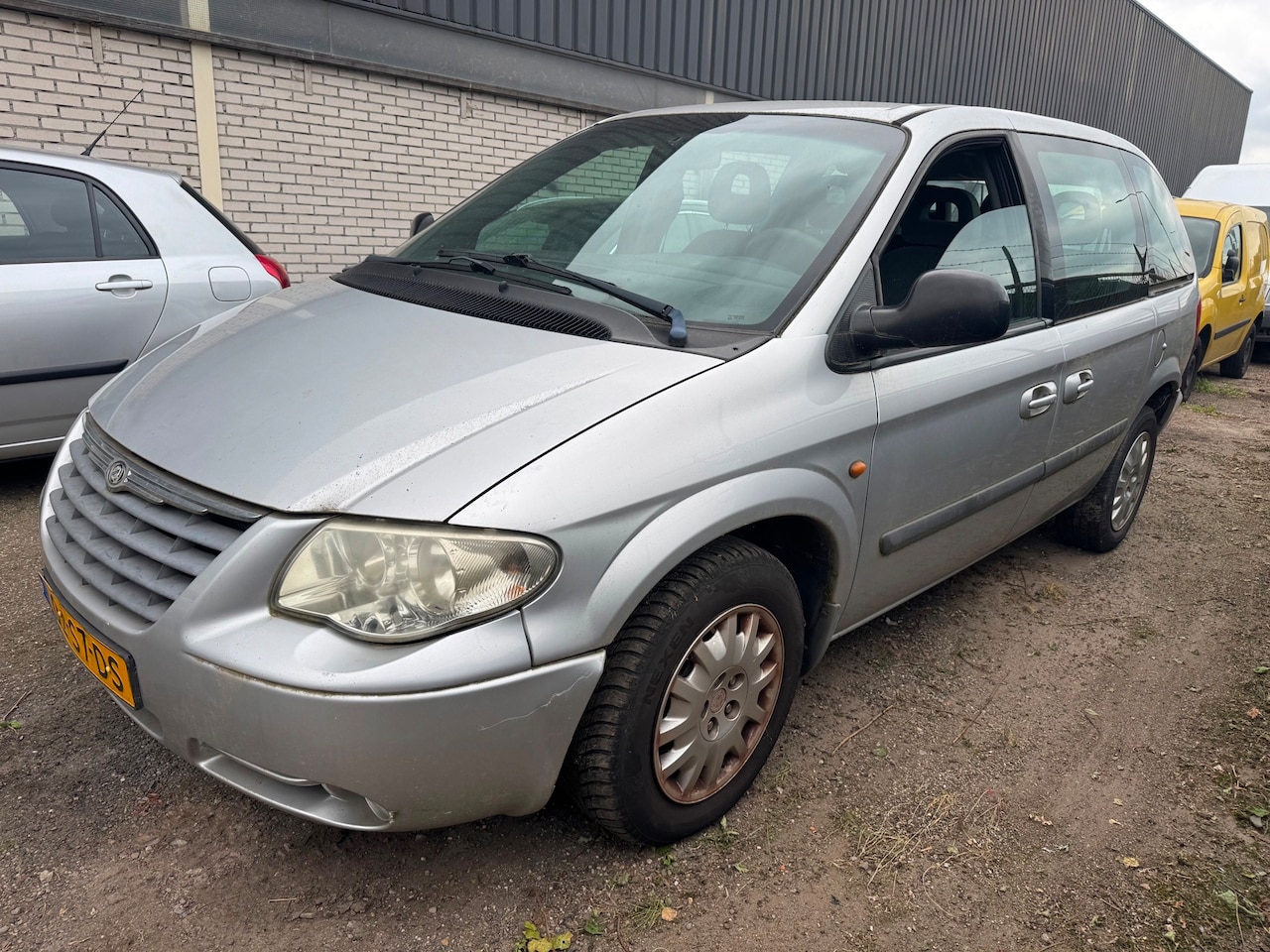 Chrysler Voyager - 2.5 CRD SE Luxe 7 persoons Airco - AutoWereld.nl