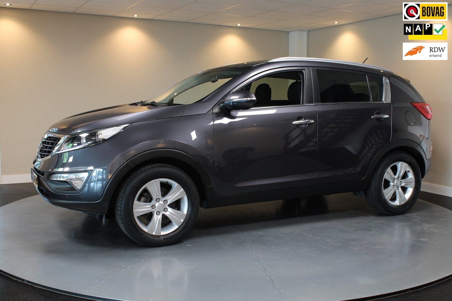 Kia Sportage - 1.6 GDI Plus Pack *Trekhaak* Airco|Cruise|All-seasons|PDC|NAP - AutoWereld.nl