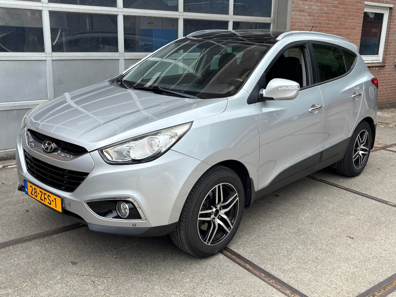 Hyundai ix35 - 1.6i GDI Style PANO,CRUISE,CLIMAT,NAV,HALF LEER - AutoWereld.nl