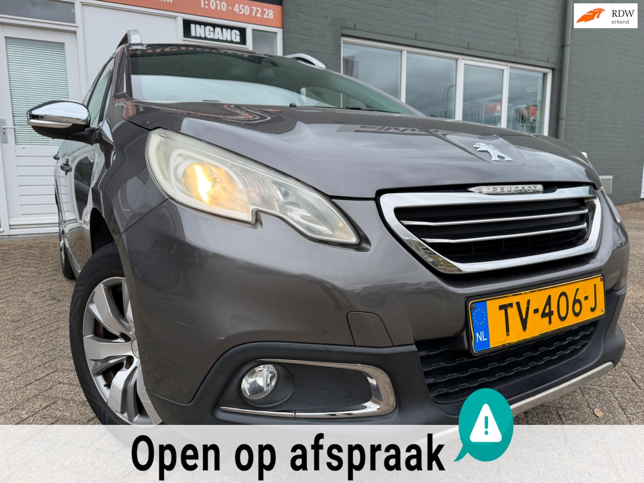 Peugeot 2008 - 1.2 VTi Allure met parkeersensoren en navigatie en bluetooth telefoon / media en cruise co - AutoWereld.nl