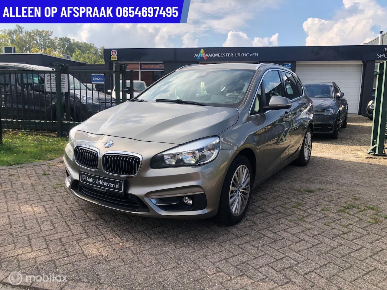 BMW 2-serie Active Tourer - 117.DKM ECC LEDER NAVI PDC 220i - AutoWereld.nl
