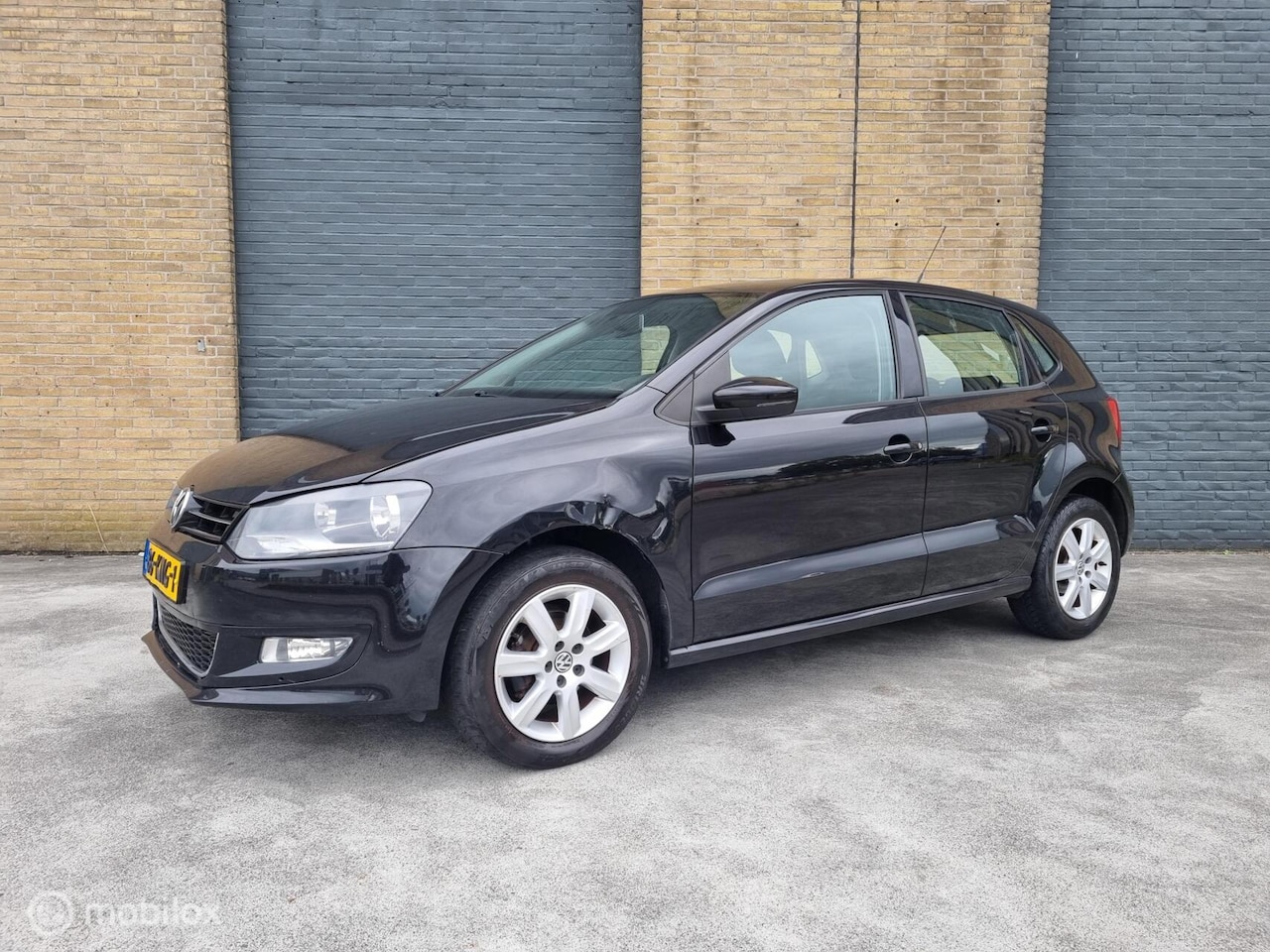 Volkswagen Polo - 1.4-16V Highline lees text - AutoWereld.nl