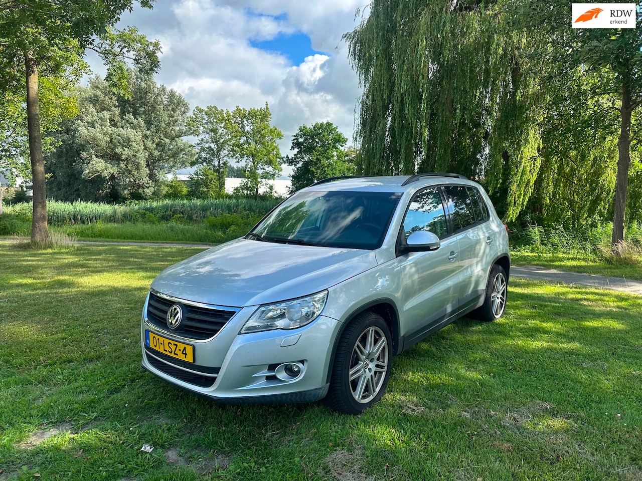 Volkswagen Tiguan - 1.4 TSI Comfort&Design 4Motion Airco Cruise Navi PDC - AutoWereld.nl
