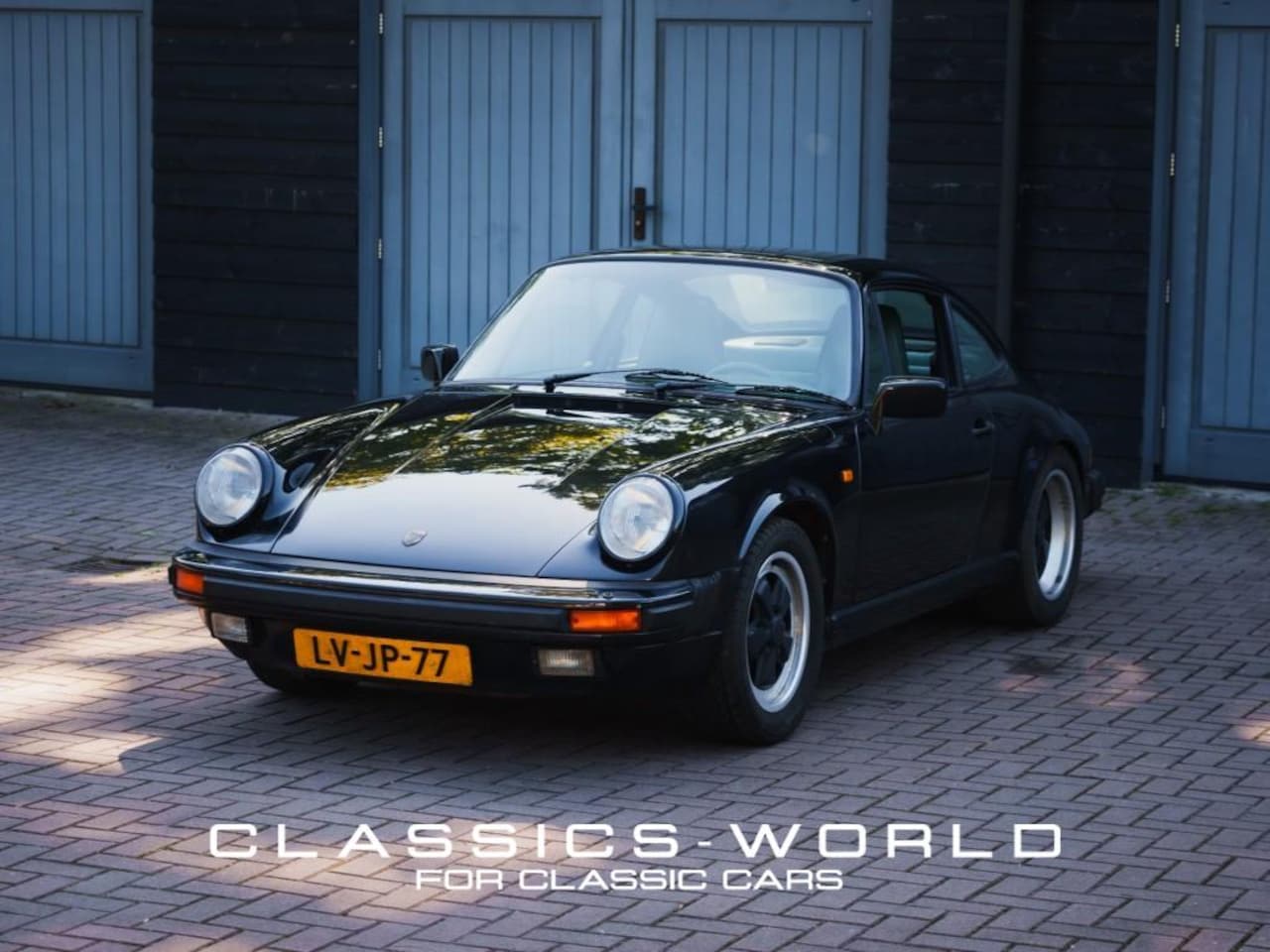Porsche 911 - 3.2 Carrera Coupé - Satin Black Metallic - AutoWereld.nl
