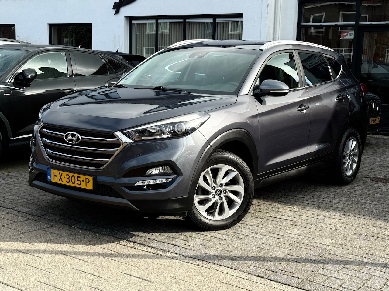 Hyundai Tucson - 1.6 GDI Comfort 1.6 GDi Comfort, Trekhaak,Stoelverwarming,Navigatie,Achteruitrij camera - AutoWereld.nl