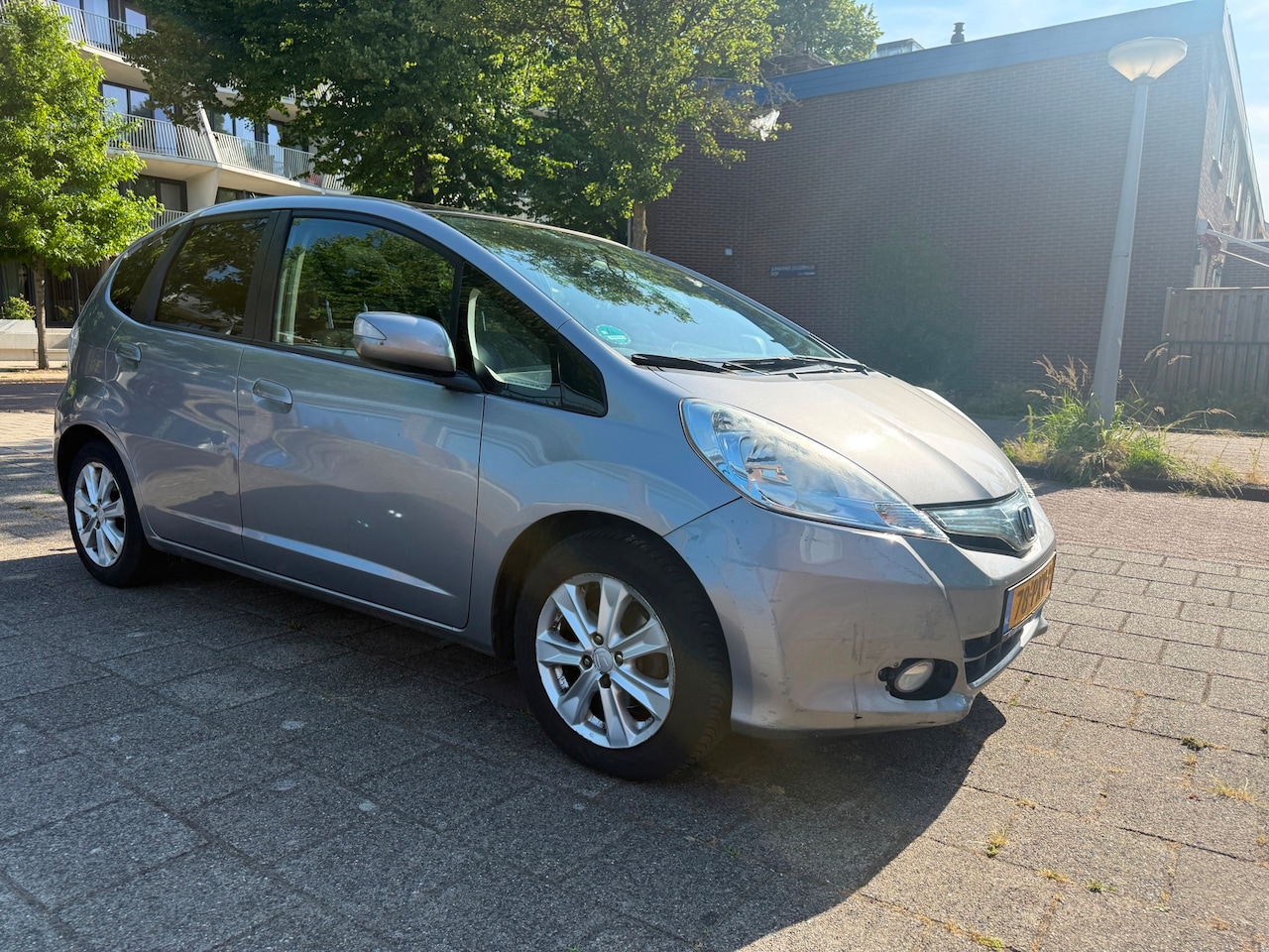 Honda Jazz - 1.4 Hybrid Elegance Cruise Panorama 1-eigenaar Climate - AutoWereld.nl