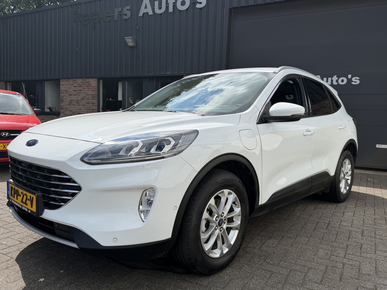 Ford Kuga - 2.5 PHEV Titanium X Plug in . Head-up display. cruise navi . apple car play . stuur -stoel - AutoWereld.nl