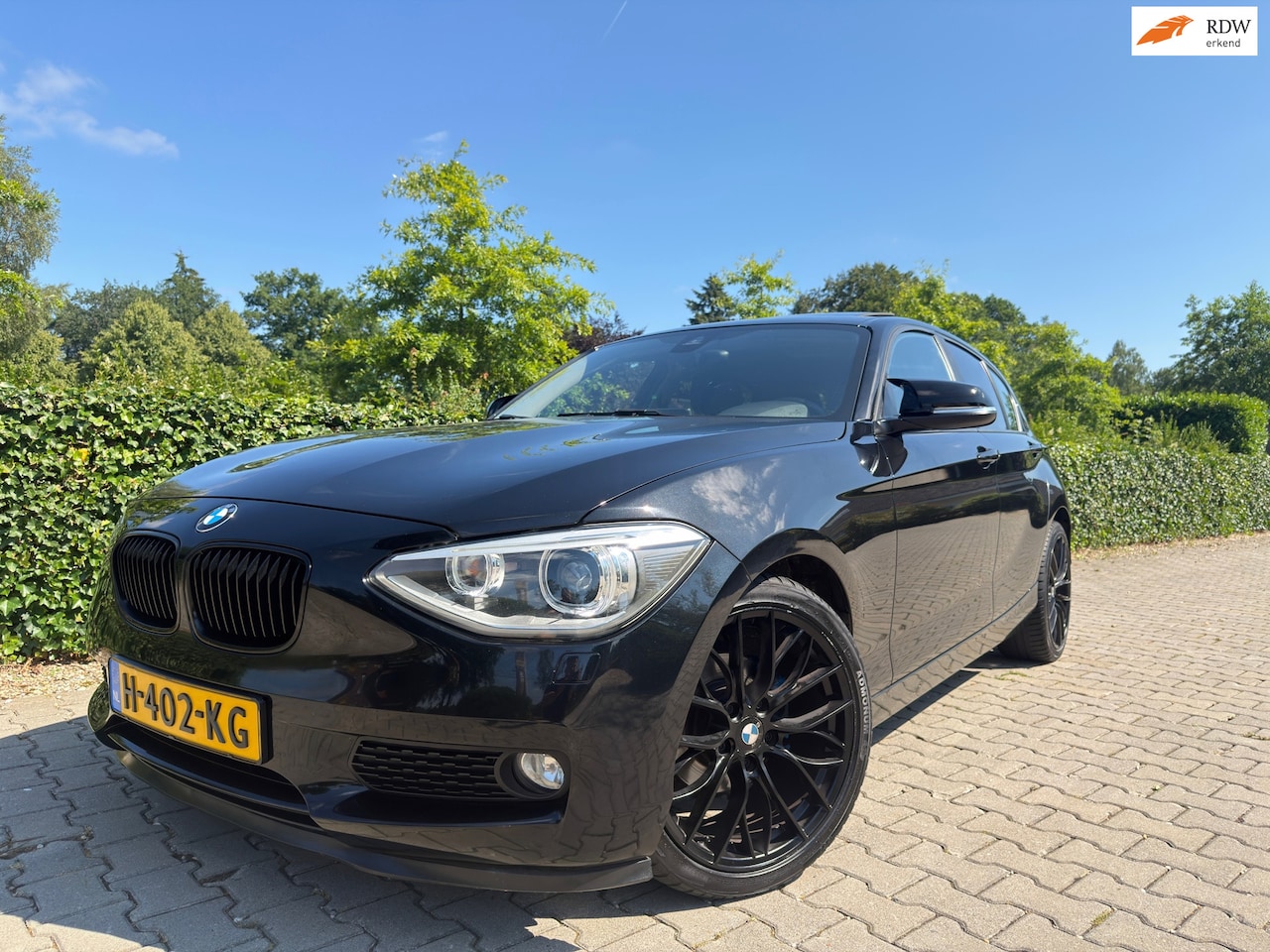 BMW 1-serie - 116i Sport Edition 5-Deurs , Clima / Cruise / Schuifdak / Navi / Led / Xenon / 18" Lm / Sp - AutoWereld.nl