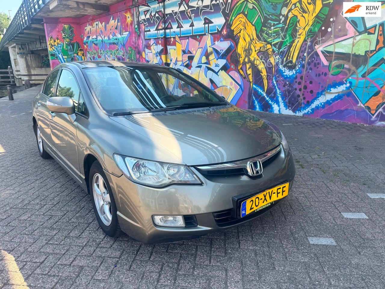 Honda Civic - 1.3 Hybrid automaat airco navigatie dvd verwarming in stoelen hele mooie auto. Ima storing - AutoWereld.nl