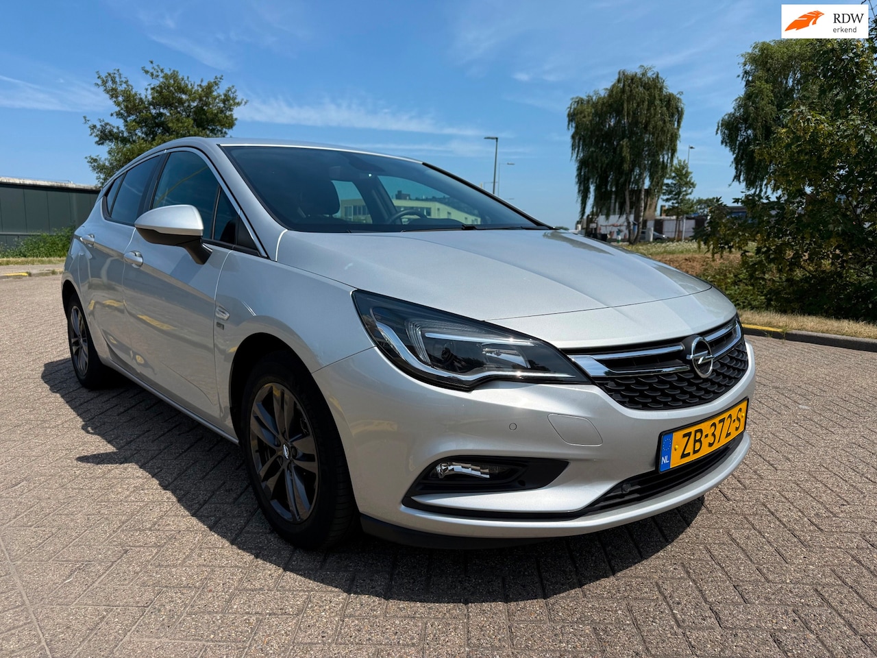 Opel Astra - 1.4 Turbo 120 Jaar Edition_AUTOMAAT_AIRCO_NETTE AUTO - AutoWereld.nl