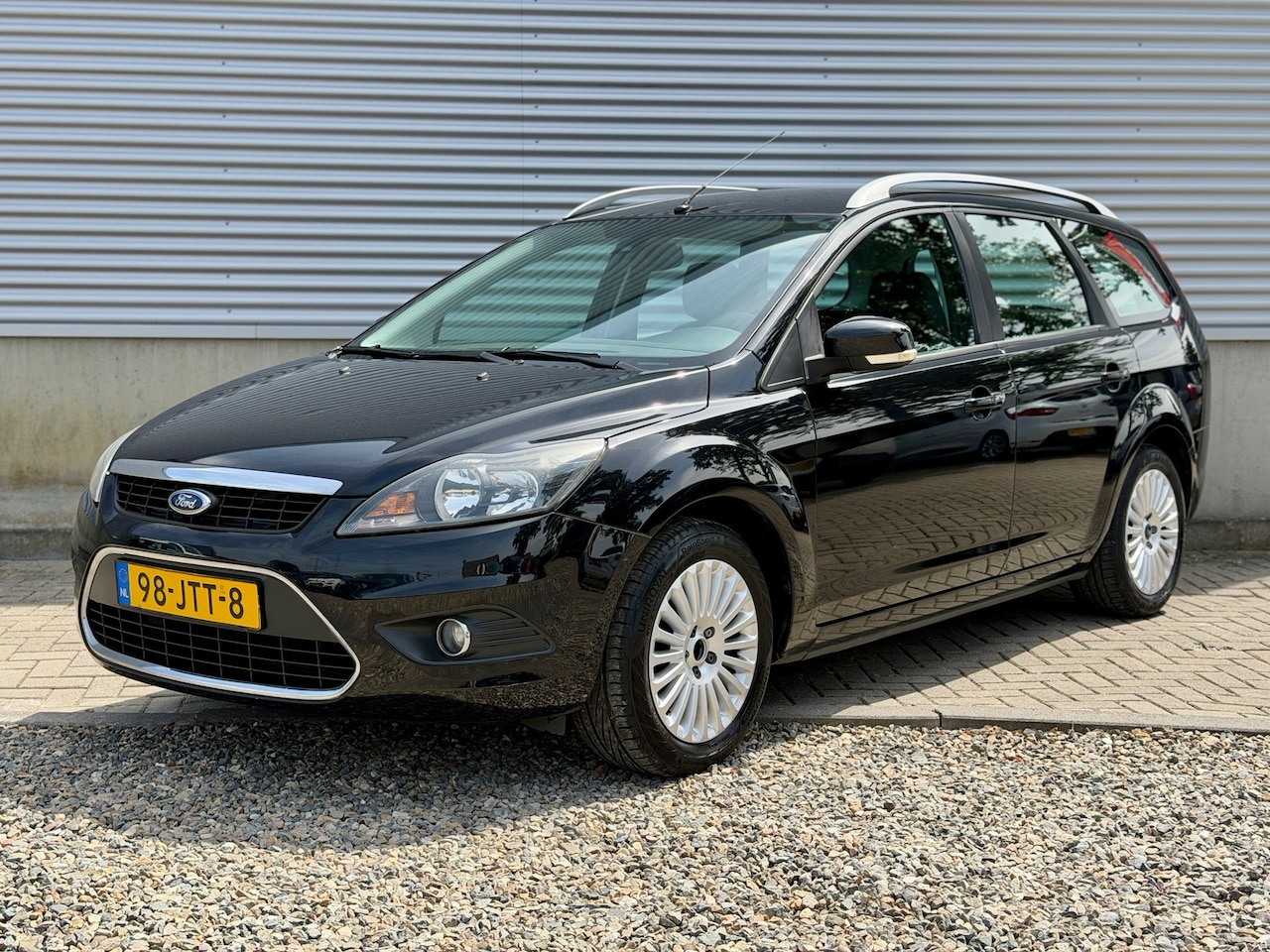 Ford Focus Wagon - 1.8 Limited [ fm navi,lmv,pdc,cruise,trekhaak ] - AutoWereld.nl