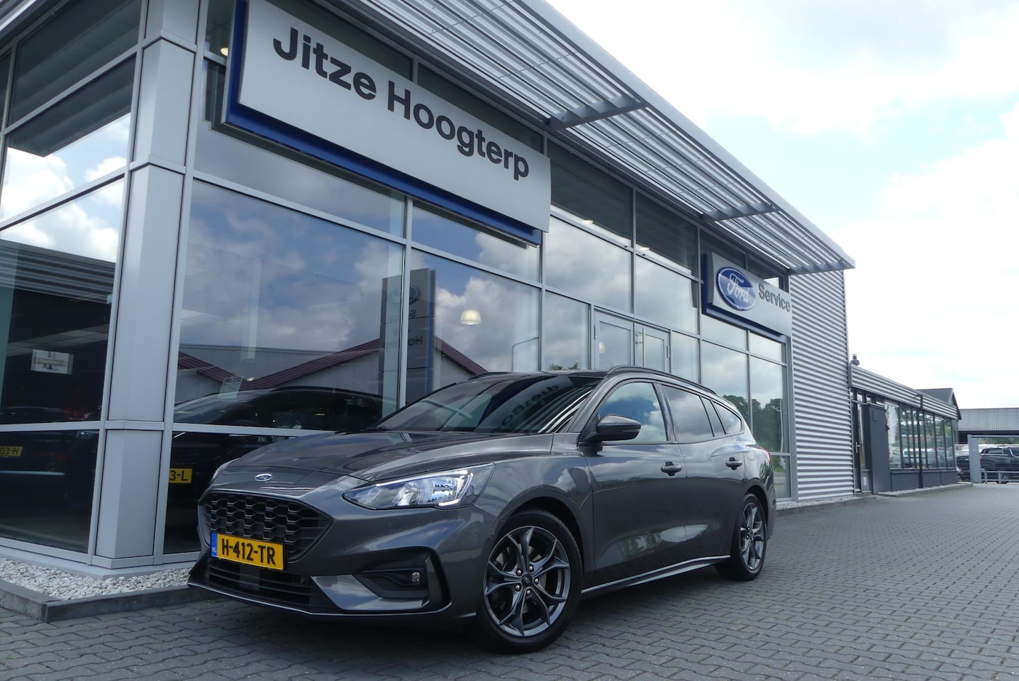 Ford Focus Wagon - 1.0 EcoBoost ST Line Business TREKHAAK (1.000KG), WINTER PACK, CRUISE, CLIMA, NAVI, CAMERA - AutoWereld.nl