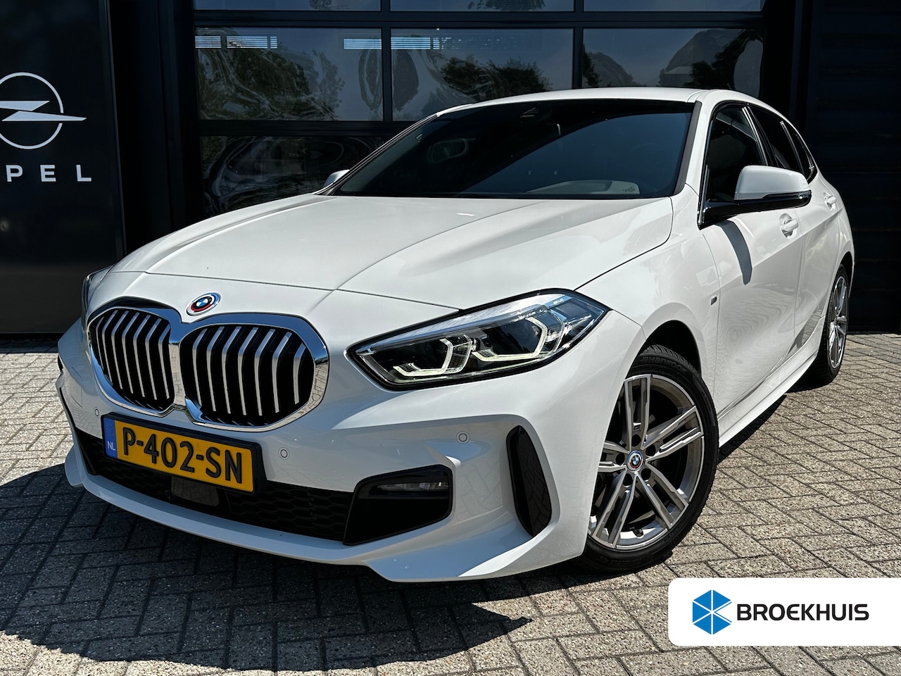 BMW 1-serie - 118i High Executive M-sport 136 PK | M-AERODYNAMICA| NAVIGATIE + APPLE CARPLAY/ANDROID AUT - AutoWereld.nl
