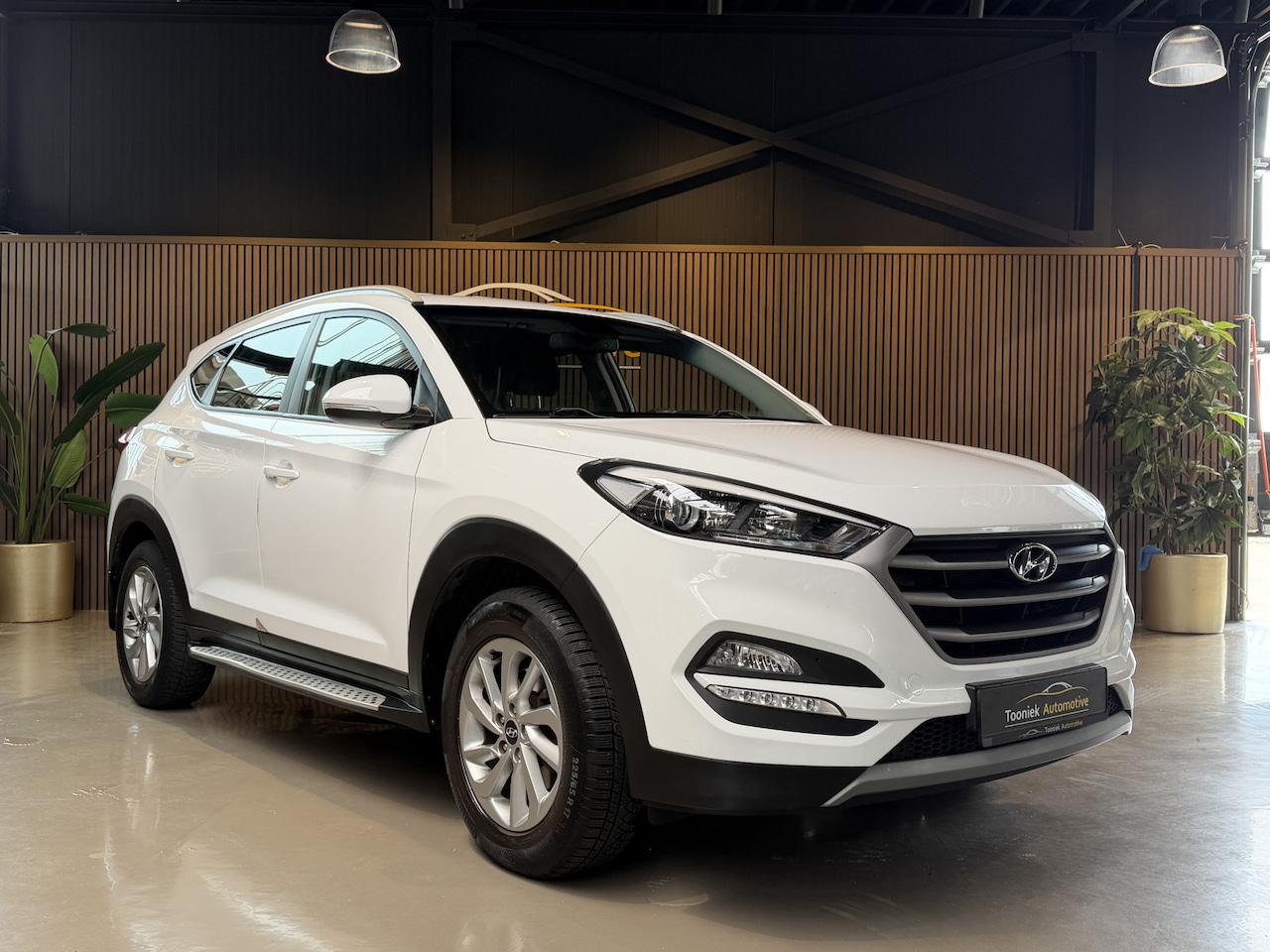 Hyundai Tucson - 1.6 GDi Comfort cruise/climate control en navigatie - AutoWereld.nl