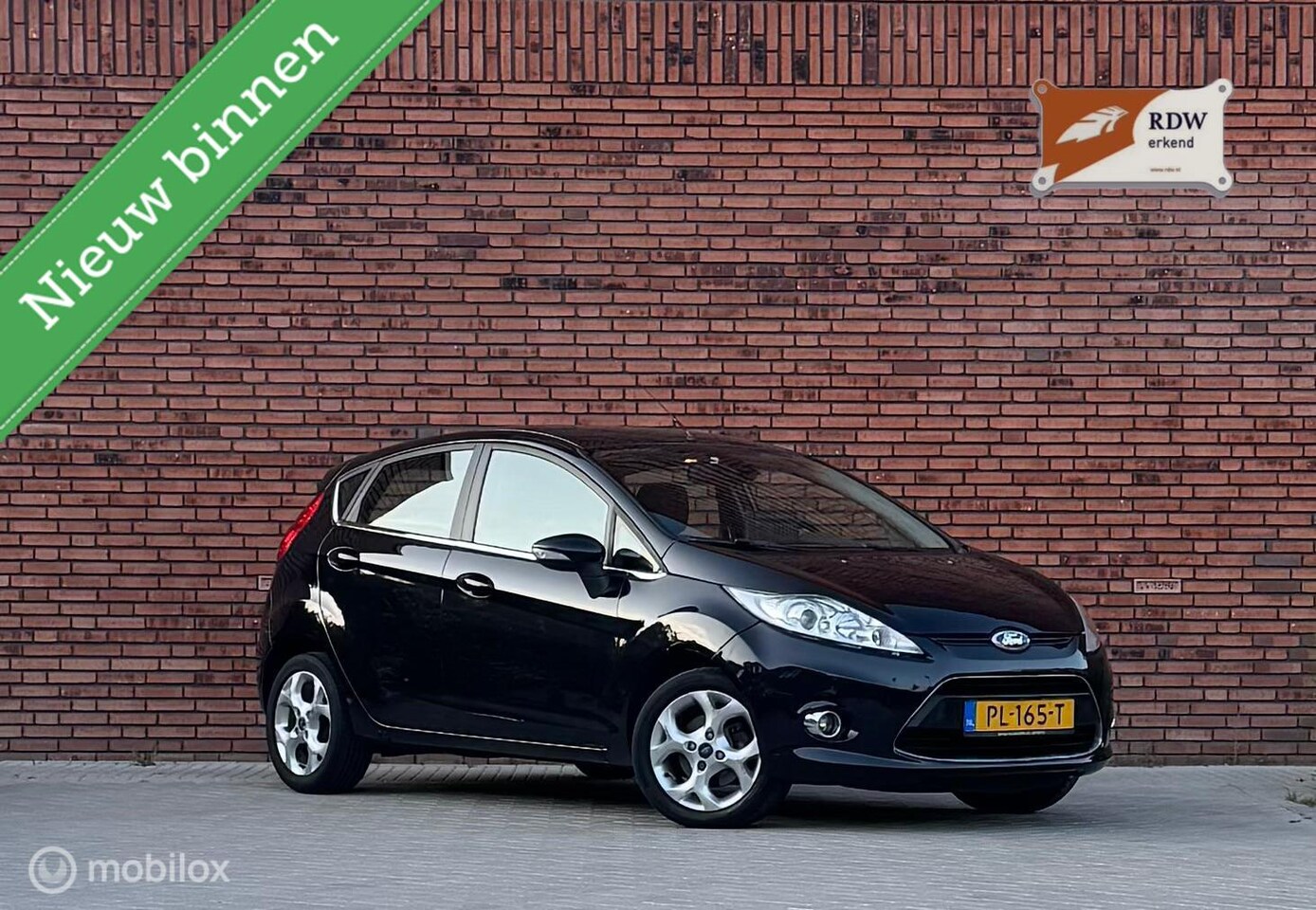 Ford Fiesta - 1.25 Ghia 1.25 Ghia - AutoWereld.nl