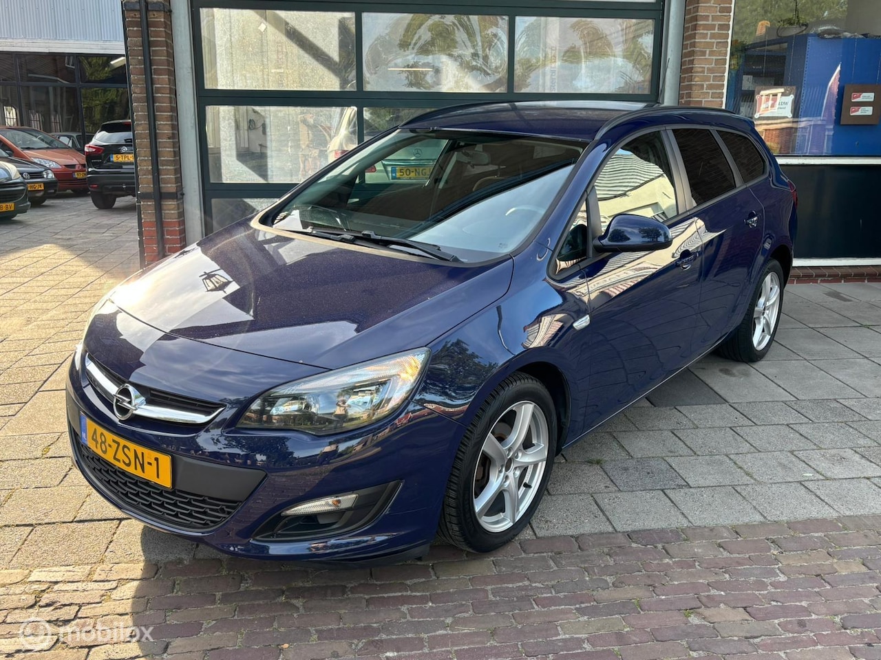 Opel Astra Sports Tourer - 1.4 Turbo Business + Airco | Cruise - AutoWereld.nl