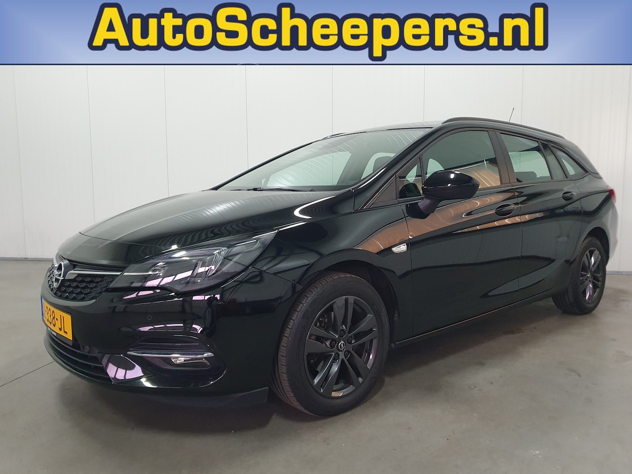 Opel Astra Sports Tourer - 1.2 Edition NAVI/PDC/CRUISE/AIRCO/LMV - AutoWereld.nl