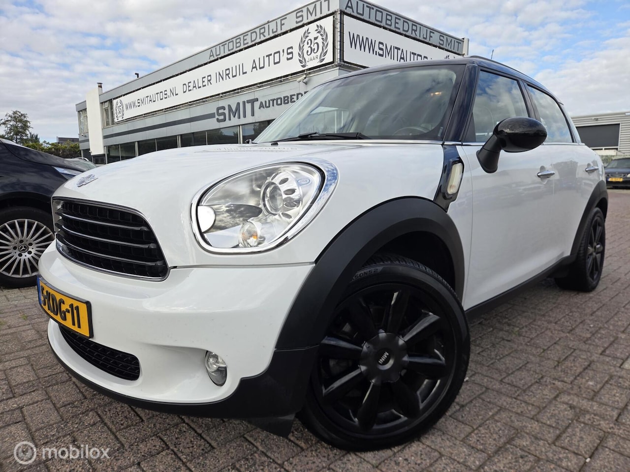 MINI Countryman - 1.6 Cooper Holland Street Pano/Leder/Nav/Xen - AutoWereld.nl