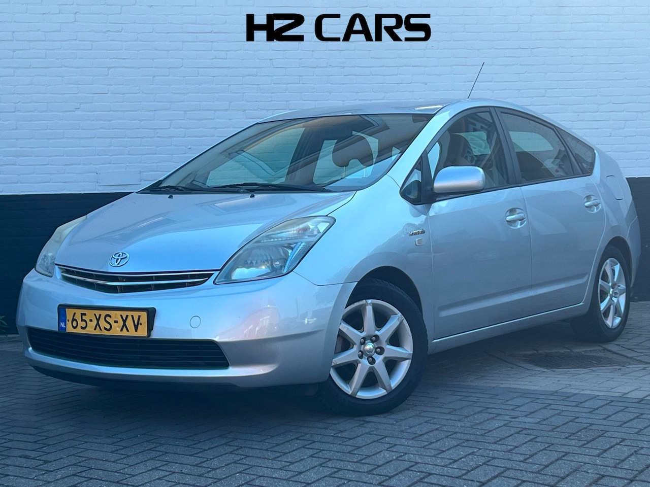Toyota Prius - 1.5 VVT-i Comfort | Trekhaak | PDC | Cruise | Clima - AutoWereld.nl