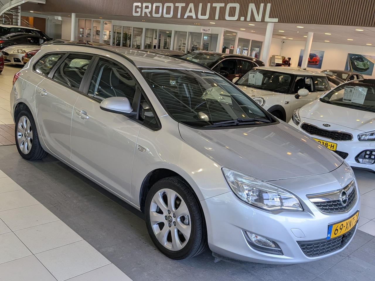 Opel Astra Sports Tourer - 1.4 Cosmo Airco, Cruise Control, Stuurbekrachtiging - AutoWereld.nl