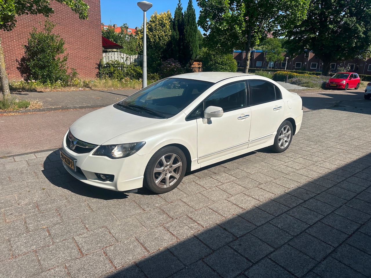 Honda Civic - 1.3 IMA Hybrid Black leather White Matallic Automaat - AutoWereld.nl