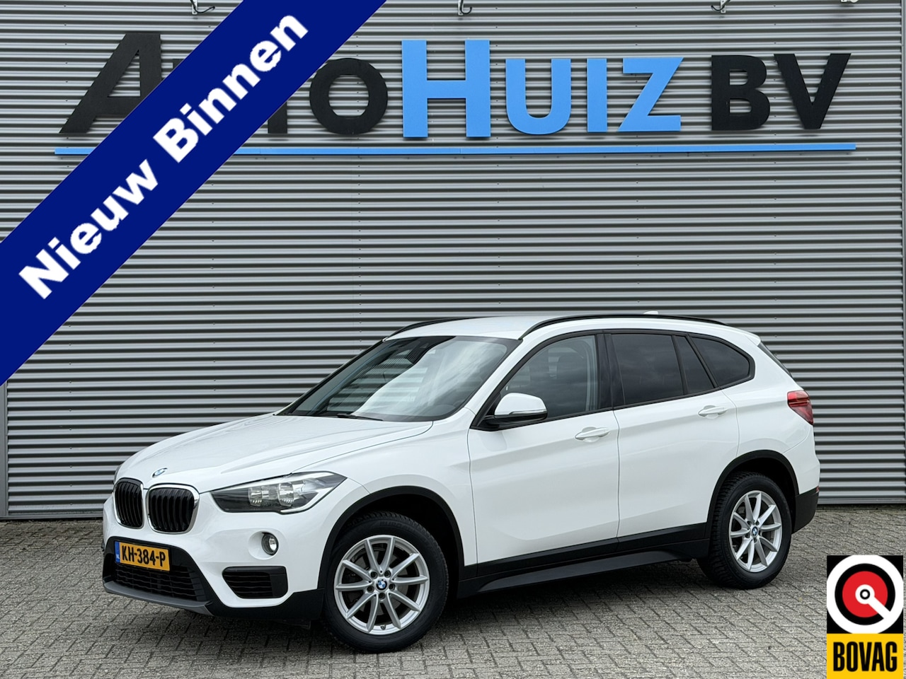 BMW X1 - sDrive18i Advantage Navigatie Stoelverwarming Climate Control PDC Cruise Control - AutoWereld.nl
