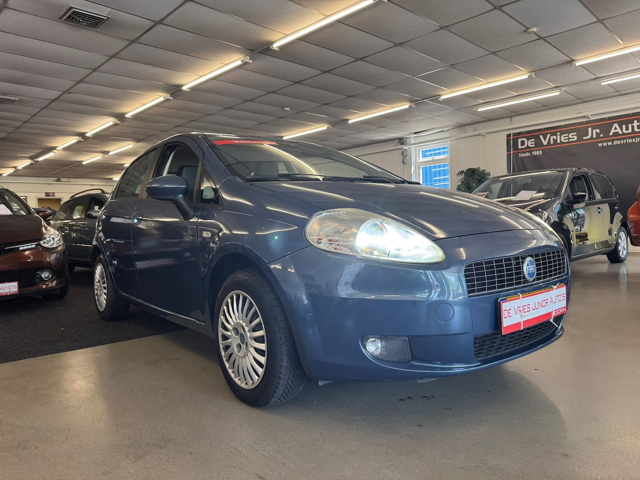 Fiat Grande Punto - 1.2 Dynamic 1.2 Dynamic. 5-drs, cruise control, airco, xenon en trekhaak! - AutoWereld.nl