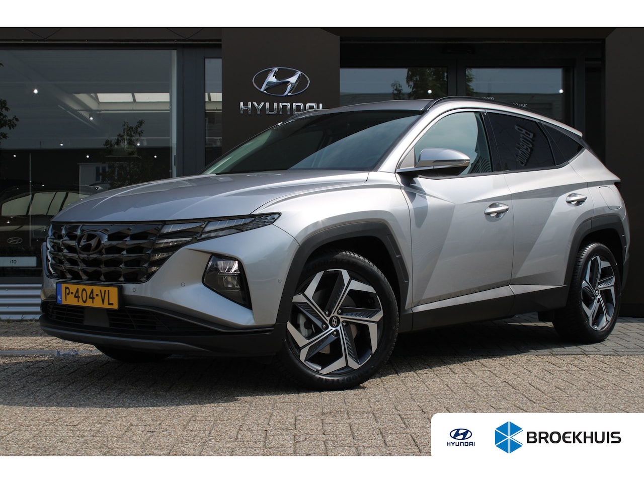 Hyundai Tucson - 1.6 T-GDI HEV Premium | Airco (automatisch) | Lichtmetalen velgen 19" | Navigatiesysteem f - AutoWereld.nl