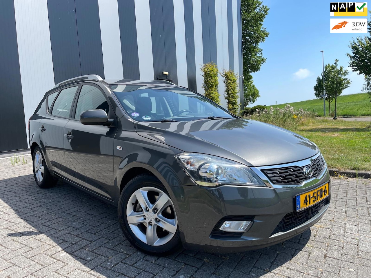Kia Cee'd Sporty Wagon - 1.4 CVVT Navigator Plus Pack Nw APK-Airco-Cruise-Lmv - AutoWereld.nl