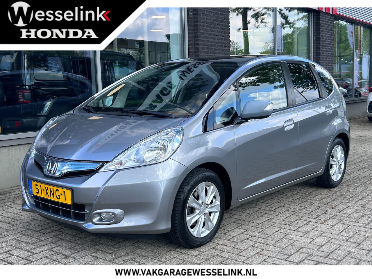 Honda Jazz - 1.4 Hybrid Elegance | fietsendrager set | panorama dak | All season banden | - AutoWereld.nl