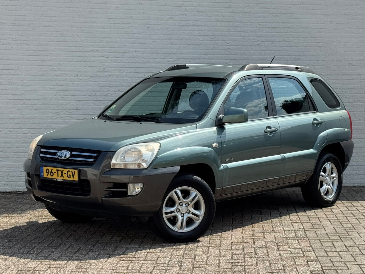 Kia Sportage - 2.0 CVVT Comfort 4 WD Clima Cruise PDC Achter Radio/CD speler Trekhhaak - AutoWereld.nl