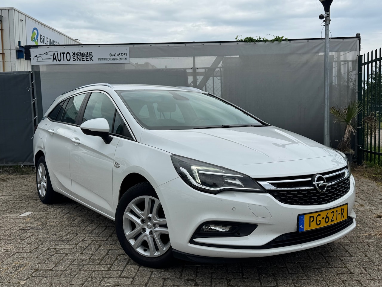 Opel Astra Sports Tourer - 1.0 Online Edition-Airco-Cruise-PDC-NAVI-06-27 - AutoWereld.nl