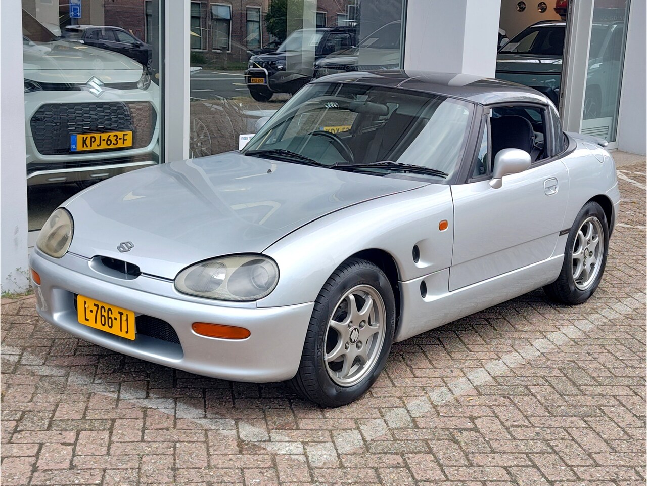 Suzuki Cappuccino - 0.7 ROADSTER AUTOMAAT Airco | Audio-installatie | Houtinleg - AutoWereld.nl