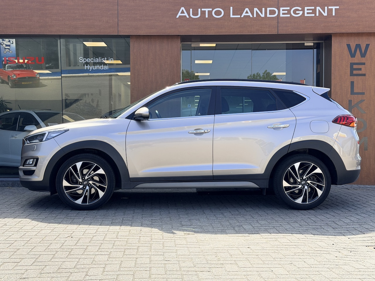 Hyundai Tucson - 1.6 T-GDI 4WD Premium Sky | Trekhaak | Full options - AutoWereld.nl