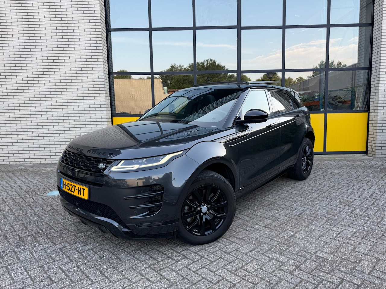 Land Rover Range Rover Evoque - 2.0 P200 AWD R-Dynamic 2.0 P200 AWD R-Dynamic, Schuif/ kanteldak, stoel & Stuurwielverwarming - AutoWereld.nl