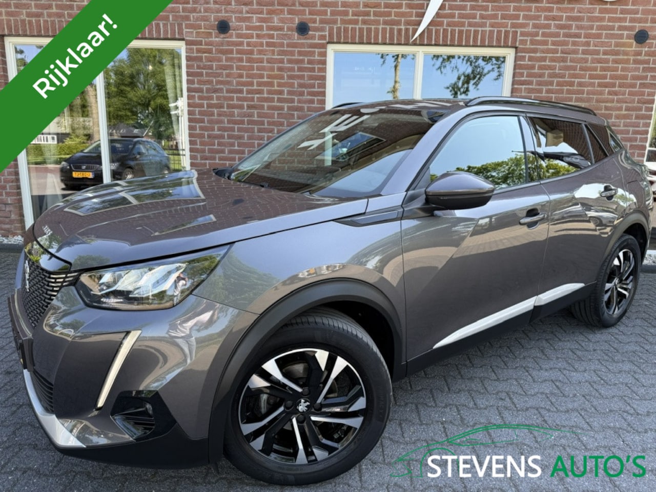 Peugeot 2008 - 1.2 PureTech Allure CAMERA / 1/2LEER / NAVI / CARPLAY / ANDROID - AutoWereld.nl