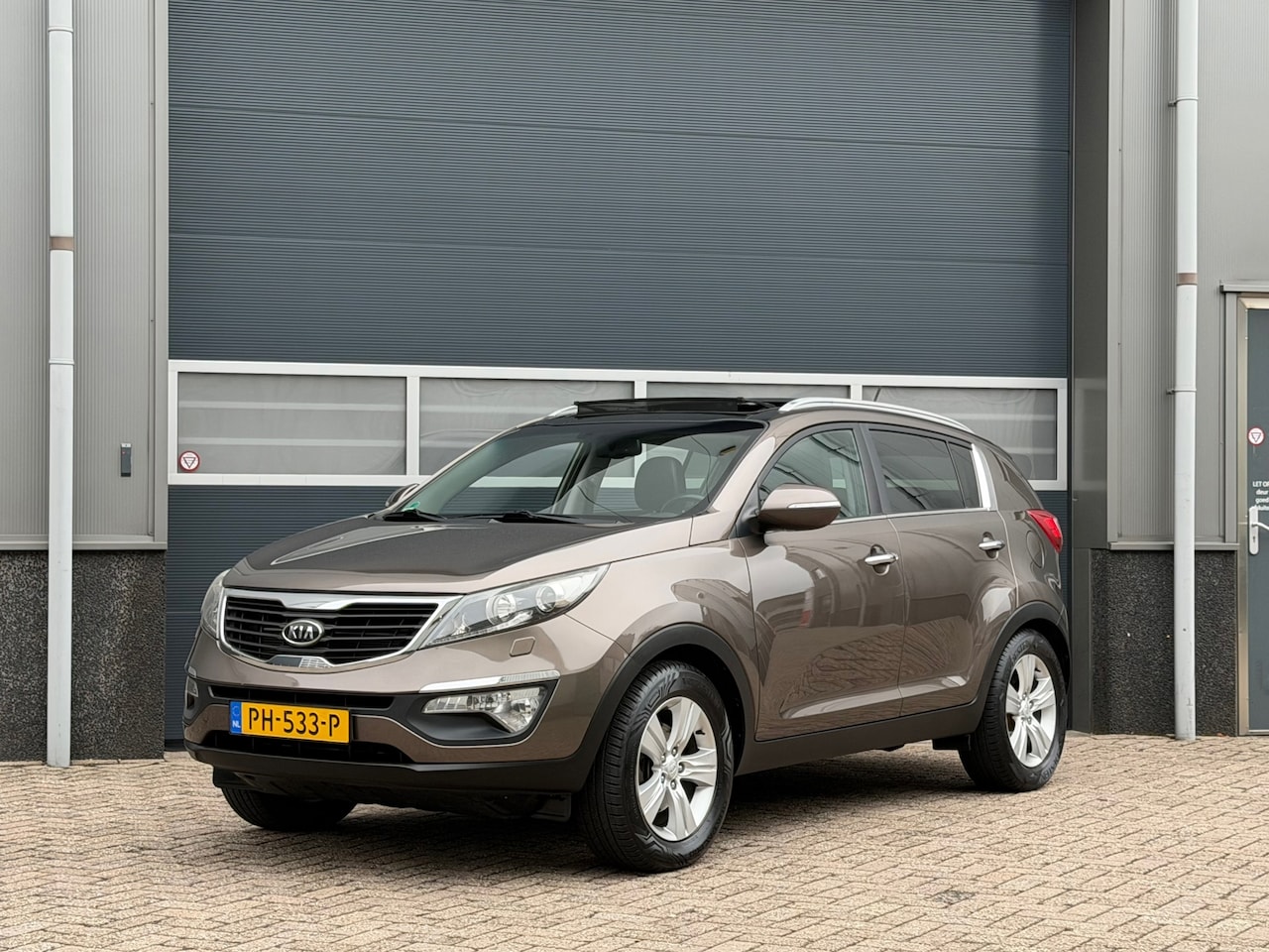 Kia Sportage - 1.6 GDI ISG X-clusive bj.2011 Camera|Navi|Pano|Trekhaak. - AutoWereld.nl