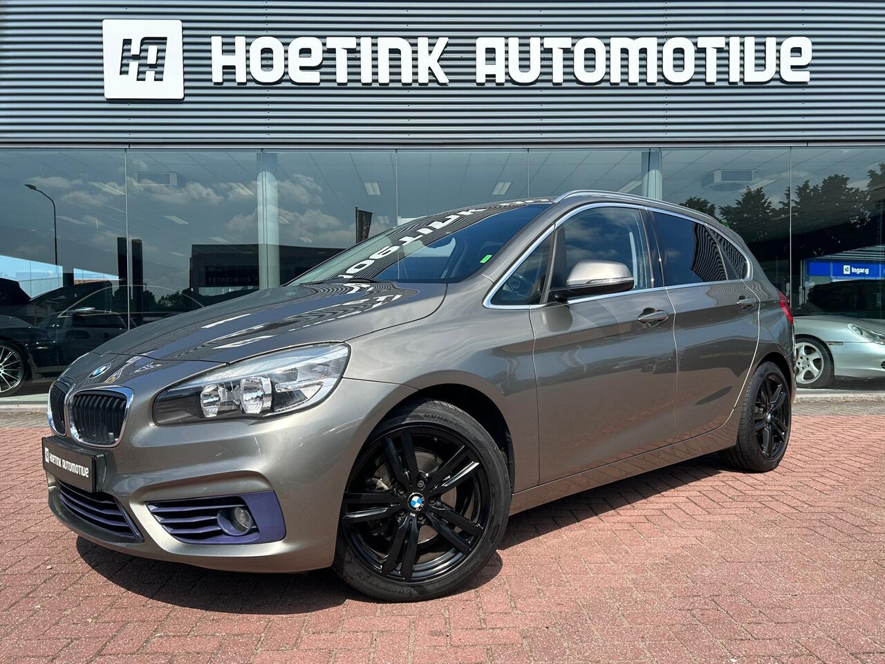 BMW 2-serie Active Tourer - 218i Sport | Airco | Navi | Sport-line | Sensoren | Trekhaak - AutoWereld.nl
