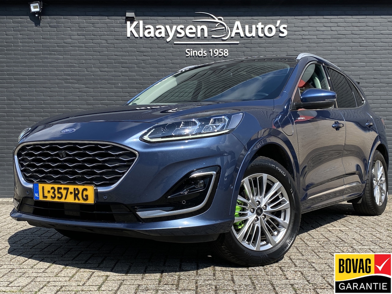 Ford Kuga - 2.5 PHEV Vignale 225 pk | dealer onderh. | panoramadak | leder interieur | elektr. v. stoe - AutoWereld.nl