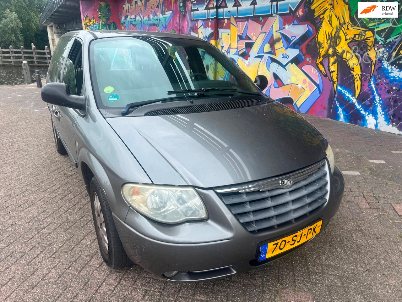 Chrysler Voyager - 2.4i SE Luxe airco schuifdeuren inklapbare spiegels àlles elektrisch stereo boeken aanwezi - AutoWereld.nl