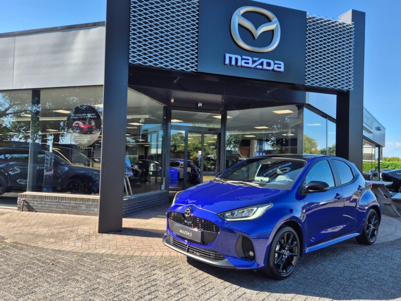 Mazda 2 Hybrid - MAZDA 2 HYBRID VVT-i 1.5 116 HOMURA PLUS / €2500 INRUIL VOORDEEL - AutoWereld.nl