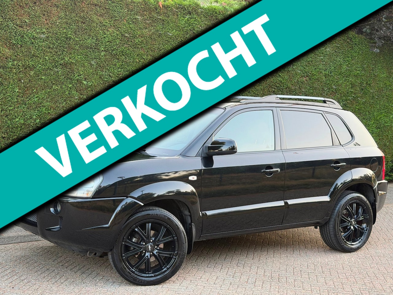 Hyundai Tucson - 2.0i Style RIJDSUPER!/NLAUTO!/LEER/AIRCO - AutoWereld.nl