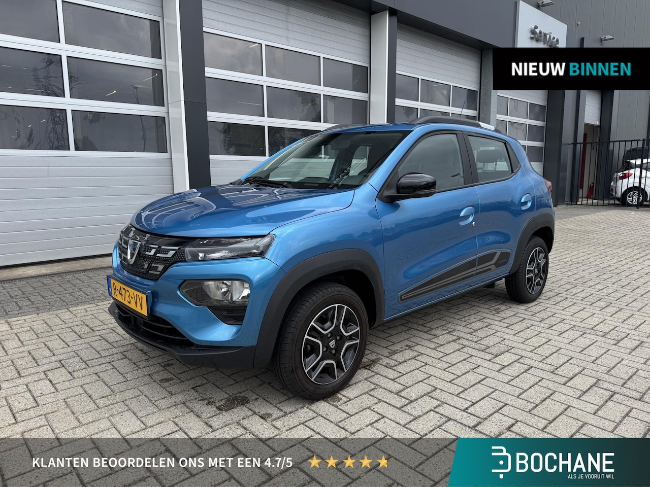 Dacia Spring - Comfort Plus (Orange Pack) 27 kWh | Navigatie | Camera | Cruise Control \| Carplay - AutoWereld.nl
