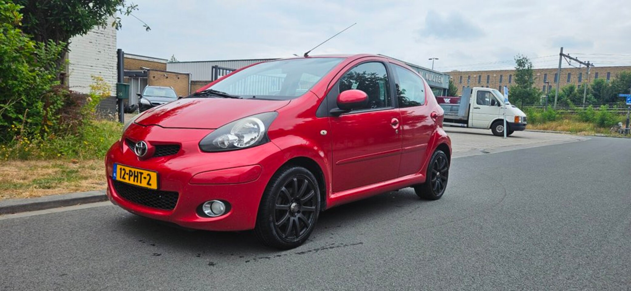 Toyota Aygo - 1.0-12V Aspiration Red Navigator 1.0-12V Aspiration Red Navigator - AutoWereld.nl