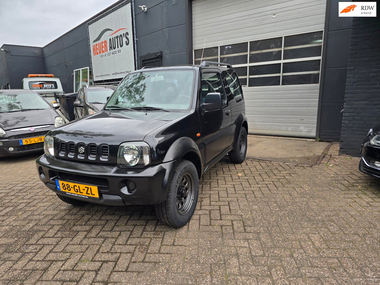 Suzuki Jimny - 1.3 JLX AUTOMAAT 1e eign. AIRCO NW APK CARPLAY - AutoWereld.nl