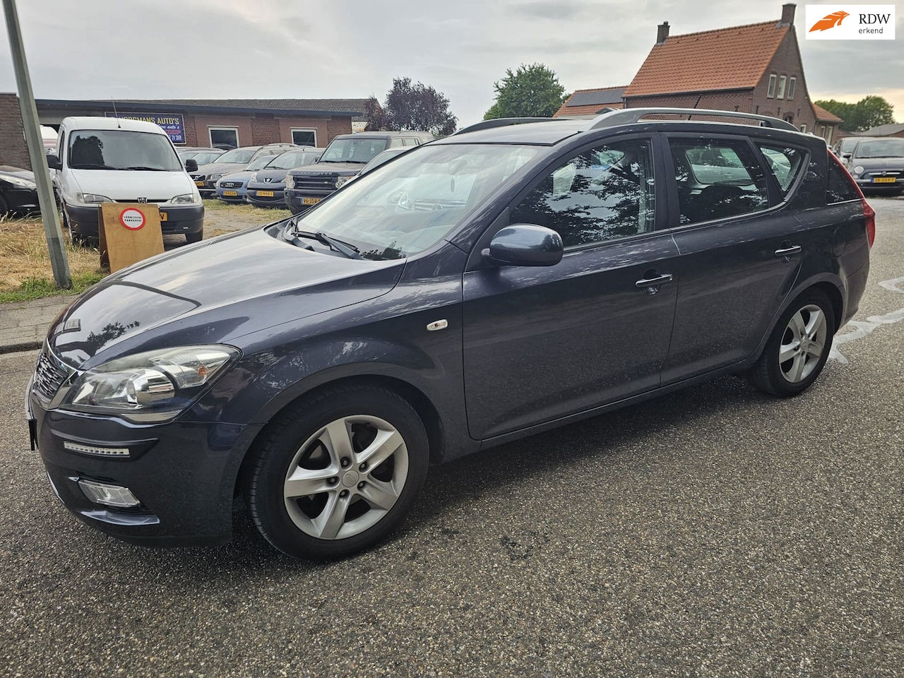 Kia Cee'd Sporty Wagon - 1.4 CVVT X-ecutive 1.4 CVVT X-ecutive - AutoWereld.nl